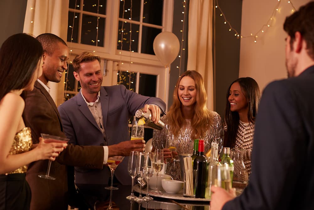 A group of friends enjoying a cocktail party at home.